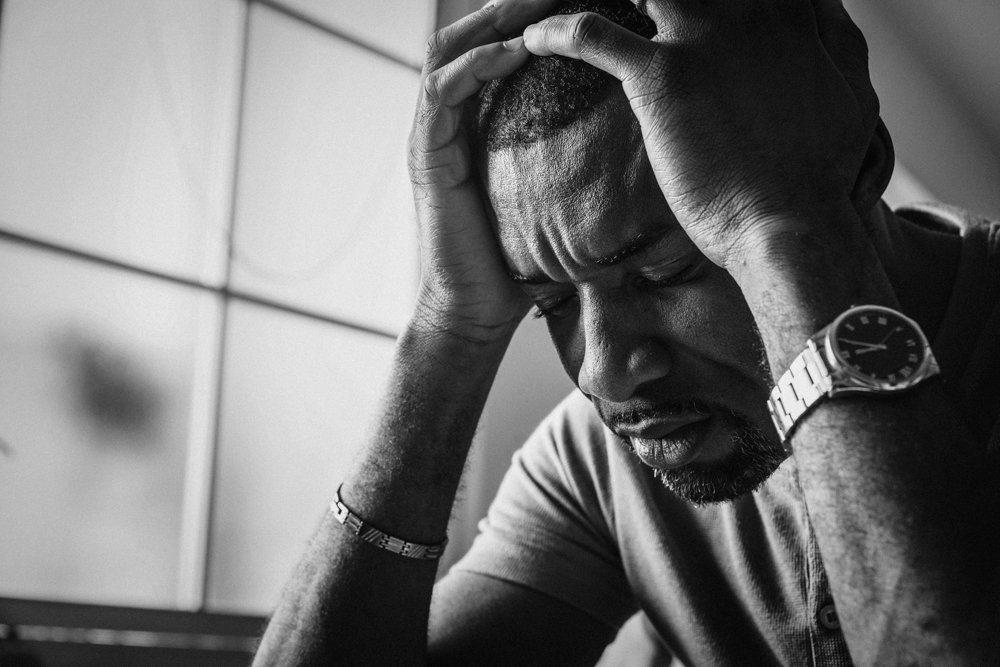 Black guy stressting and headache