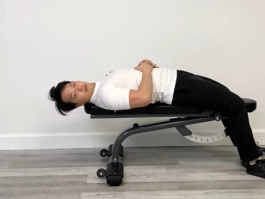 Patient performing targeted cervical proprioceptive retraining and chin tuck exercises for neck pain and dizziness in Singapore.