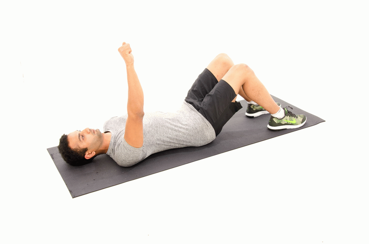 Patient performing supine scapular punches at Square One Active Recovery chiropractor clinic in Singapore for serratus anterior activation.